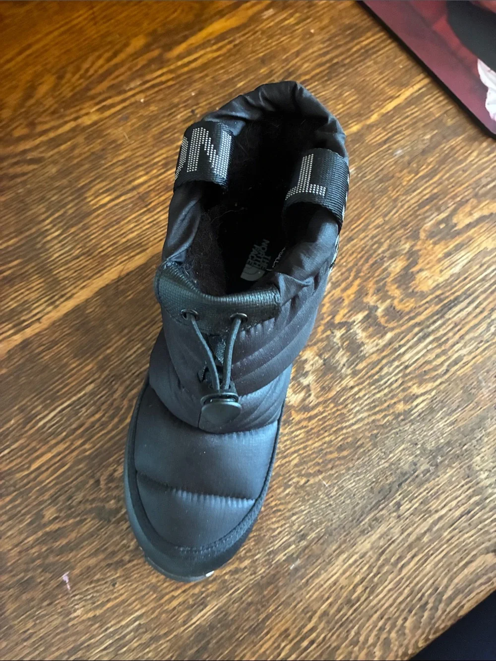 The North Face Kids Black Puffer Snow Boot with Light Gray Sole